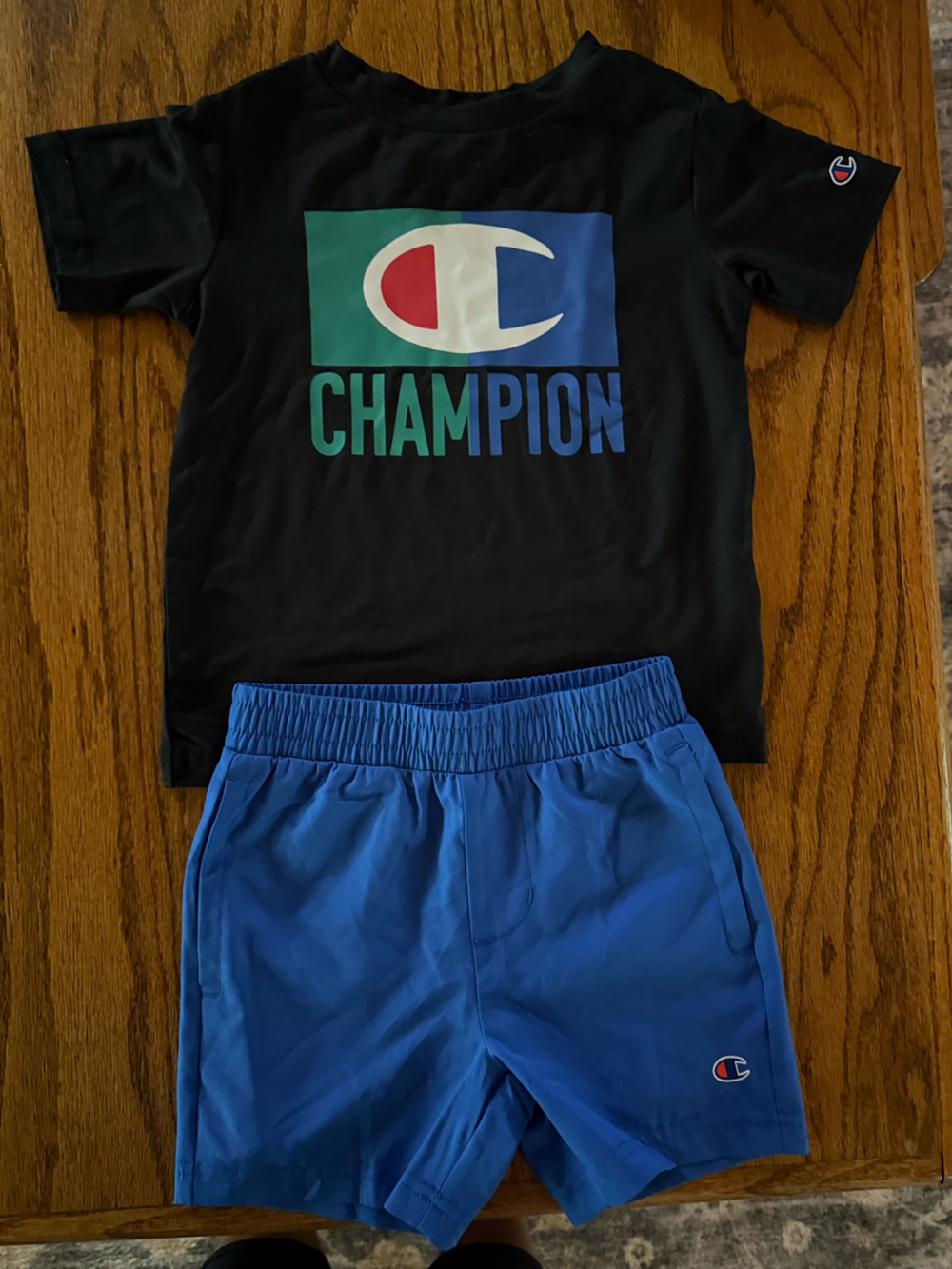 Champion Black Tee with Graphic shirt and matching blue shorts